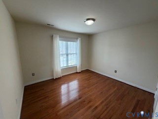 1406 Lundy Terrace Midlothian, VA 23114 - Photo 18 of 37 an empty room with wooden floor and windows