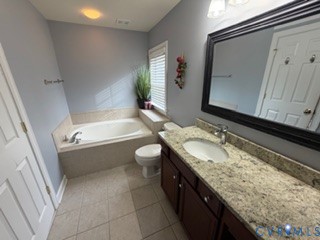 1406 Lundy Terrace Midlothian, VA 23114 - Photo 23 of 37 a bathroom with a granite countertop sink and a mirror