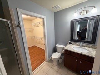 1406 Lundy Terrace Midlothian, VA 23114 - Photo 25 of 37 a bathroom with a granite countertop sink toilet a mirror and vanity