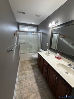 1406 Lundy Terrace Midlothian, VA 23114 - Photo 26 of 37 a bathroom with a double vanity sink a toilet a mirror and shower