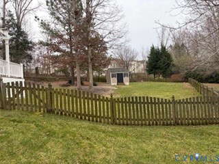 1406 Lundy Terrace Midlothian, VA 23114 - Photo 32 of 37 a view of a brick house with a big yard and large trees