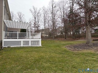 1406 Lundy Terrace Midlothian, VA 23114 - Photo 36 of 37 a view of a wooden deck with a big yard and large trees