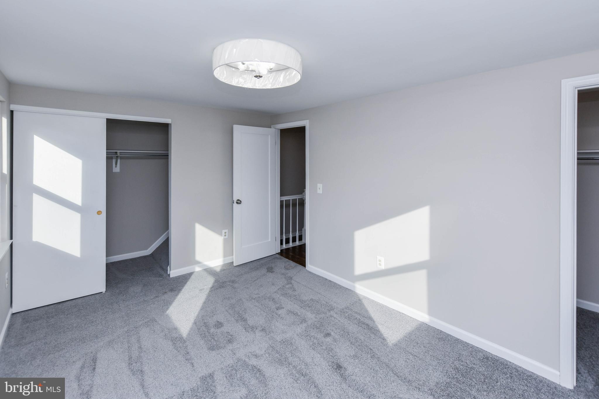 9 Dorrell Court Sterling, VA 20165 - Photo 23 of 36 an empty room with a empty space and windows