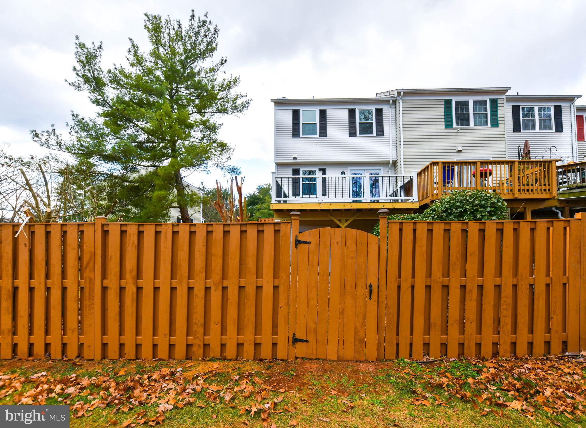 9 Dorrell Court Sterling, VA 20165 - Photo 32 of 36 a view of a house with wooden fence