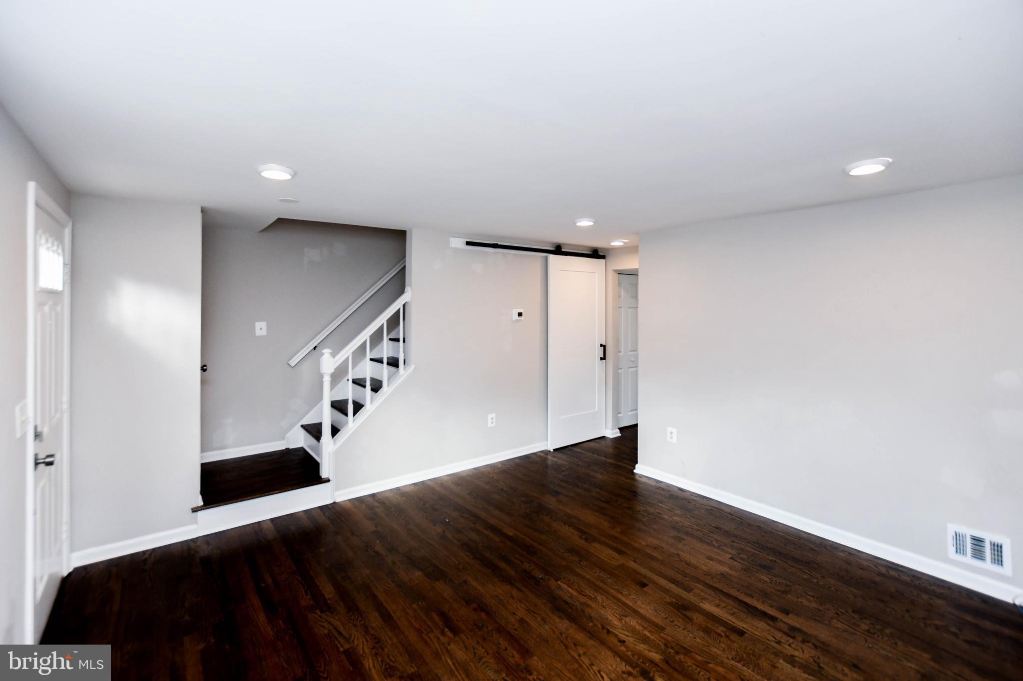 9 Dorrell Court Sterling, VA 20165 - Photo 7 of 36 a view of entryway and hall with wooden floor