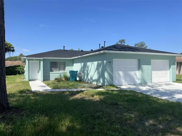 a view of a house with a yard