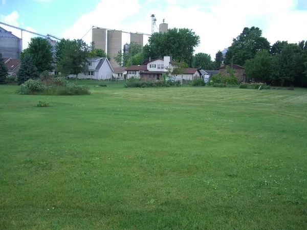 a backyard of a house with lots of green space