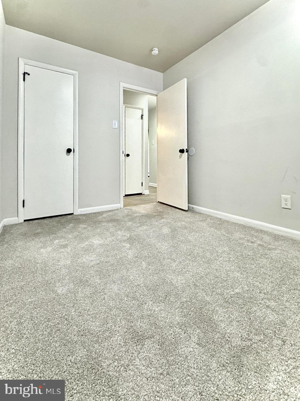 521 Martin Street, Unit A1 Philadelphia, PA 19128 - Photo 4 of 6 an empty room with an entryway