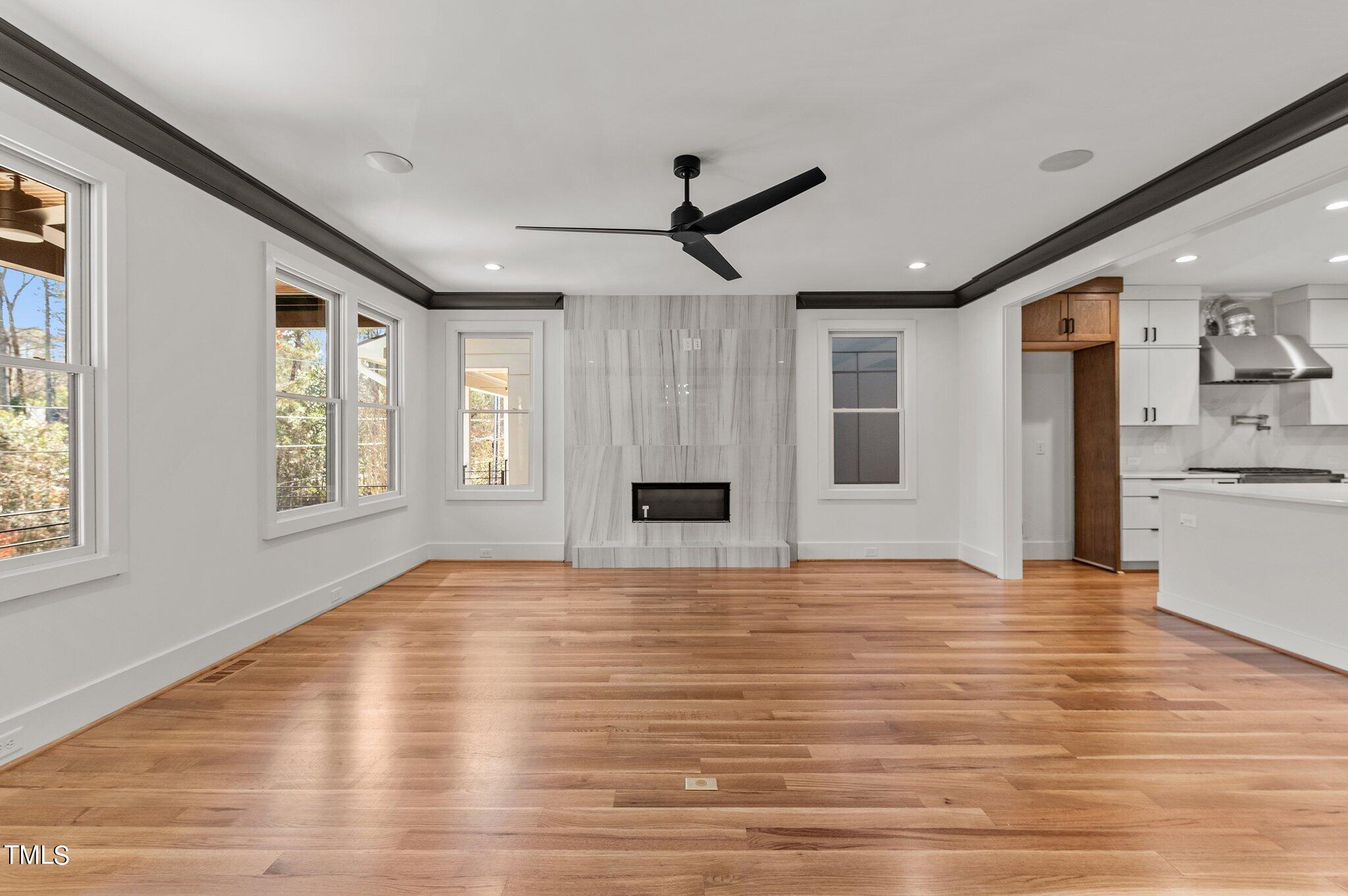 1437 Nottingham Road Raleigh, NC 27607 - Photo 12 of 61 a view of an empty room with window and wooden floor