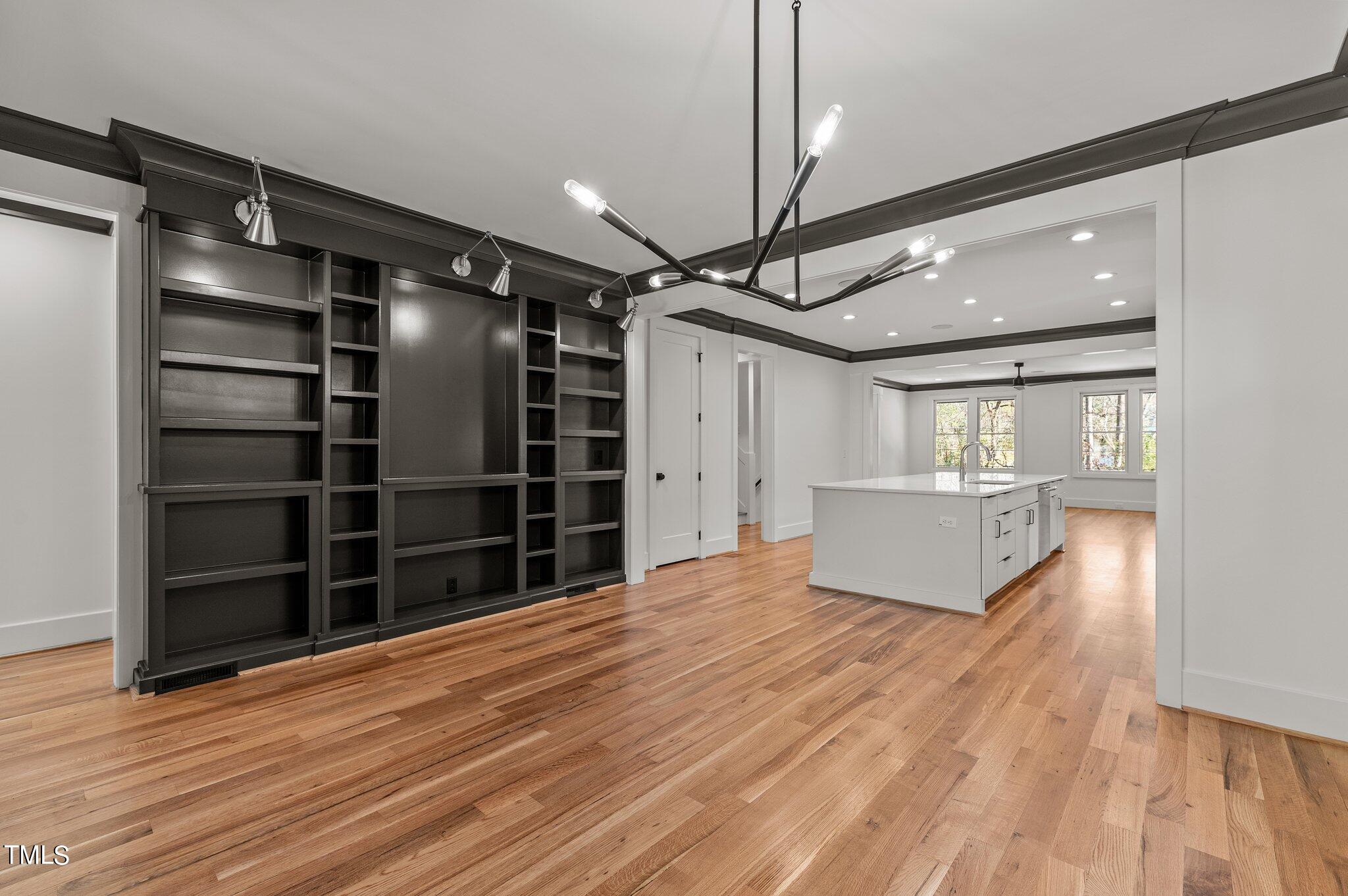 1437 Nottingham Road Raleigh, NC 27607 - Photo 20 of 61 a view of an empty room with wooden floor and a window
