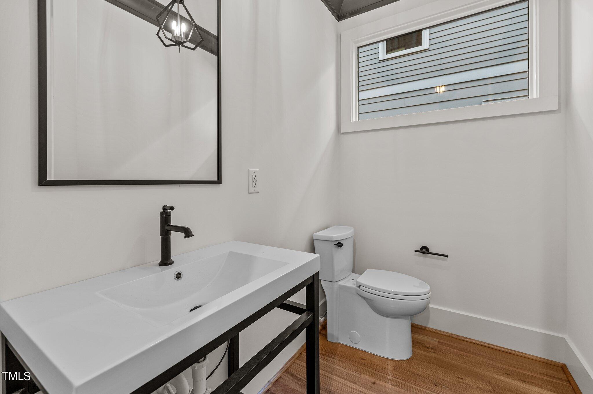 1437 Nottingham Road Raleigh, NC 27607 - Photo 25 of 61 a bathroom with a sink and a toilet