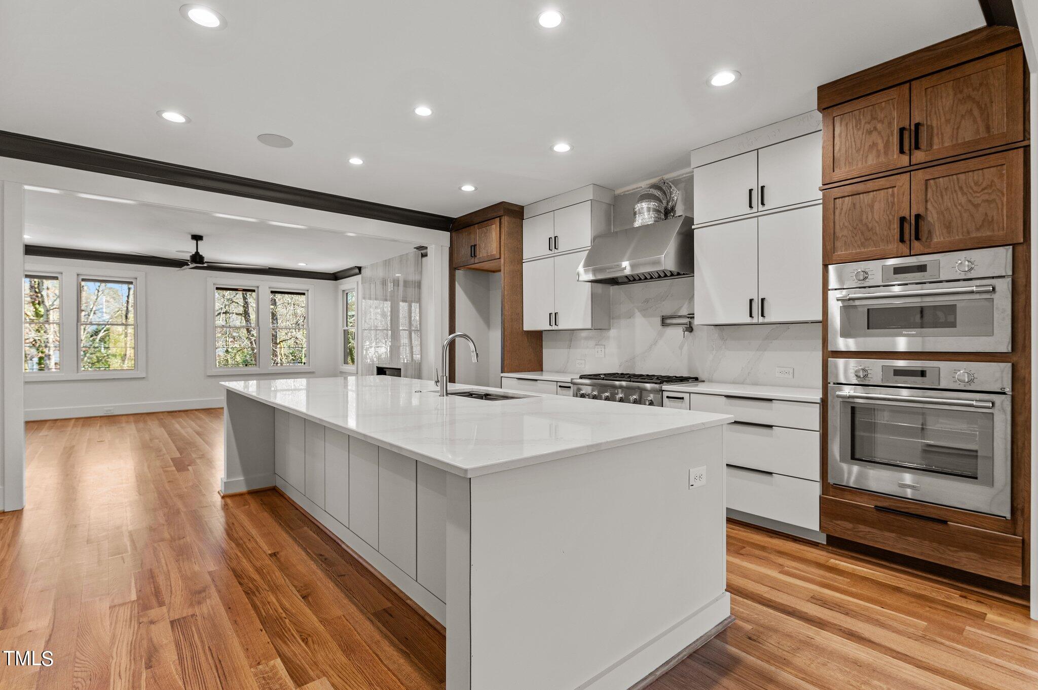 1437 Nottingham Road Raleigh, NC 27607 - Photo 3 of 61 a kitchen with stainless steel appliances granite countertop a sink stove and refrigerator