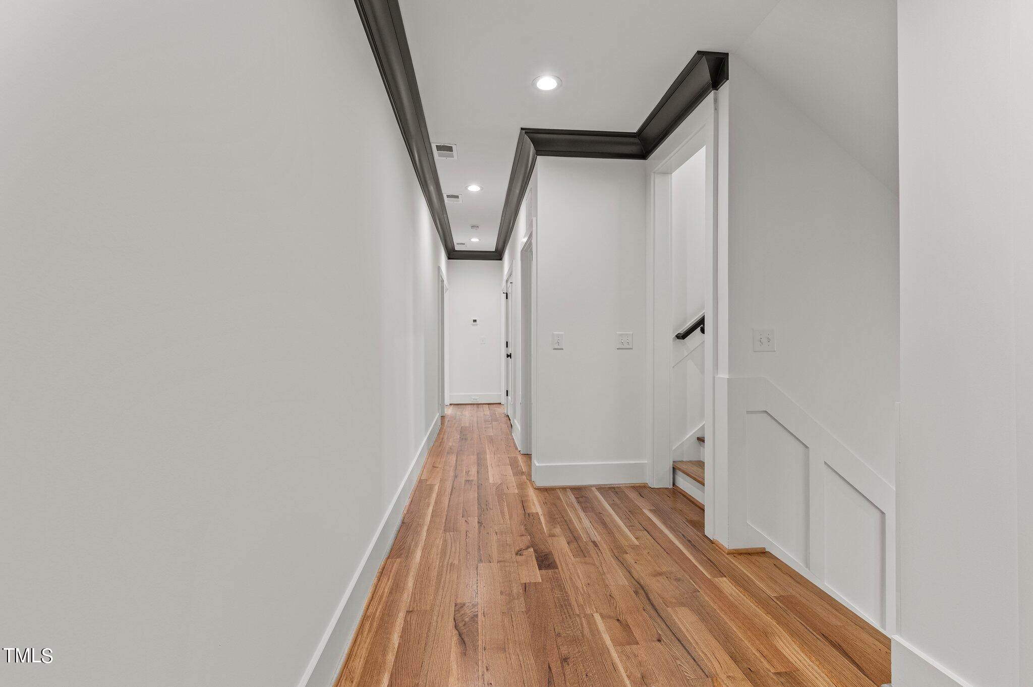 1437 Nottingham Road Raleigh, NC 27607 - Photo 32 of 61 a view of a hallway with wooden floor