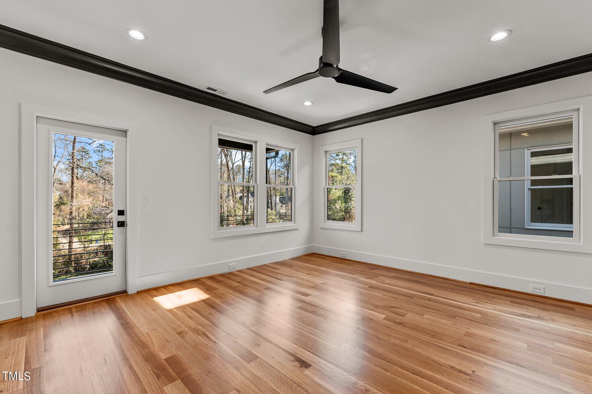 1437 Nottingham Road Raleigh, NC 27607 - Photo 33 of 61 a view of an empty room with window and wooden floor