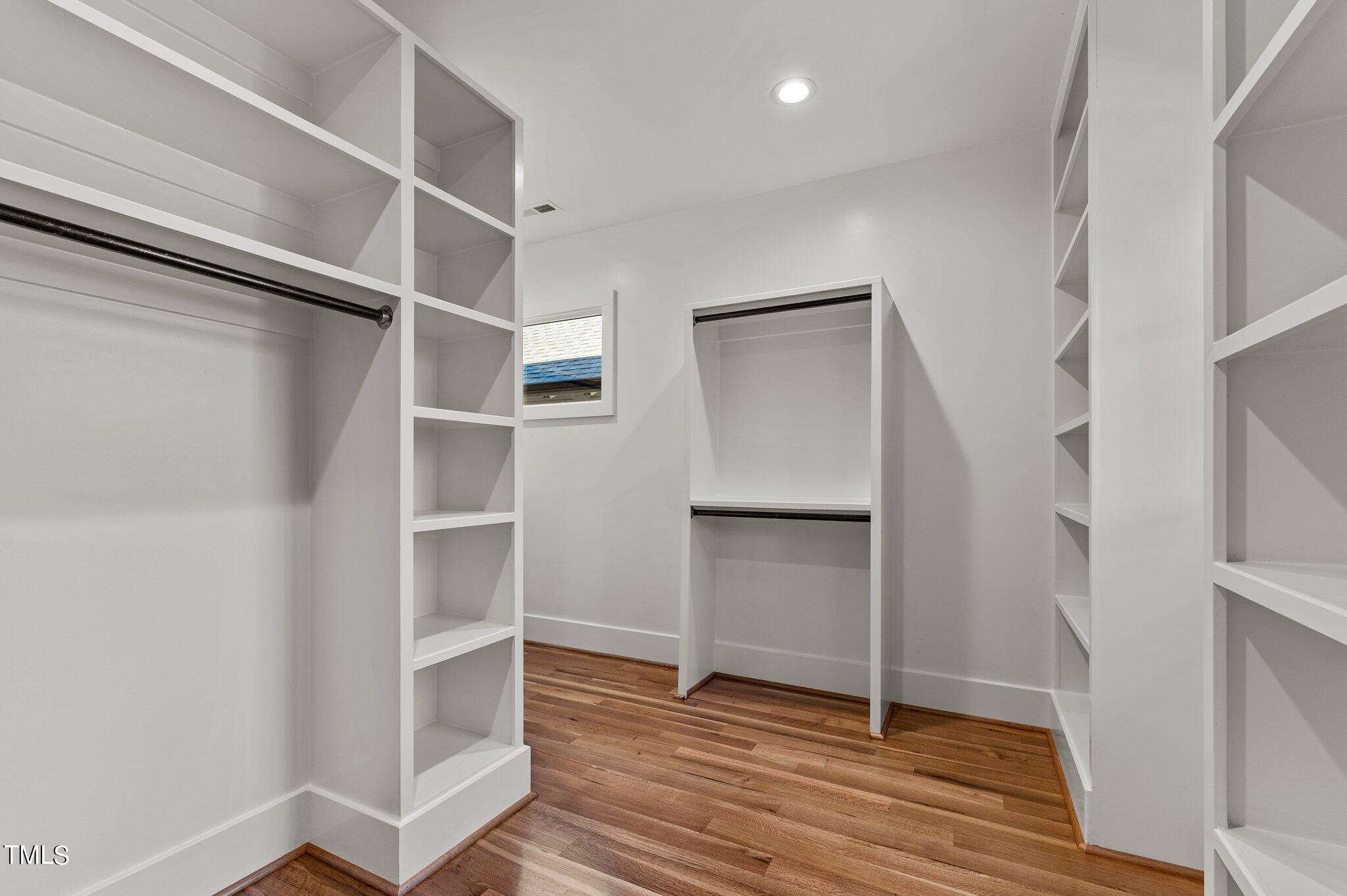 1437 Nottingham Road Raleigh, NC 27607 - Photo 34 of 61 a view of walk in closet with empty racks