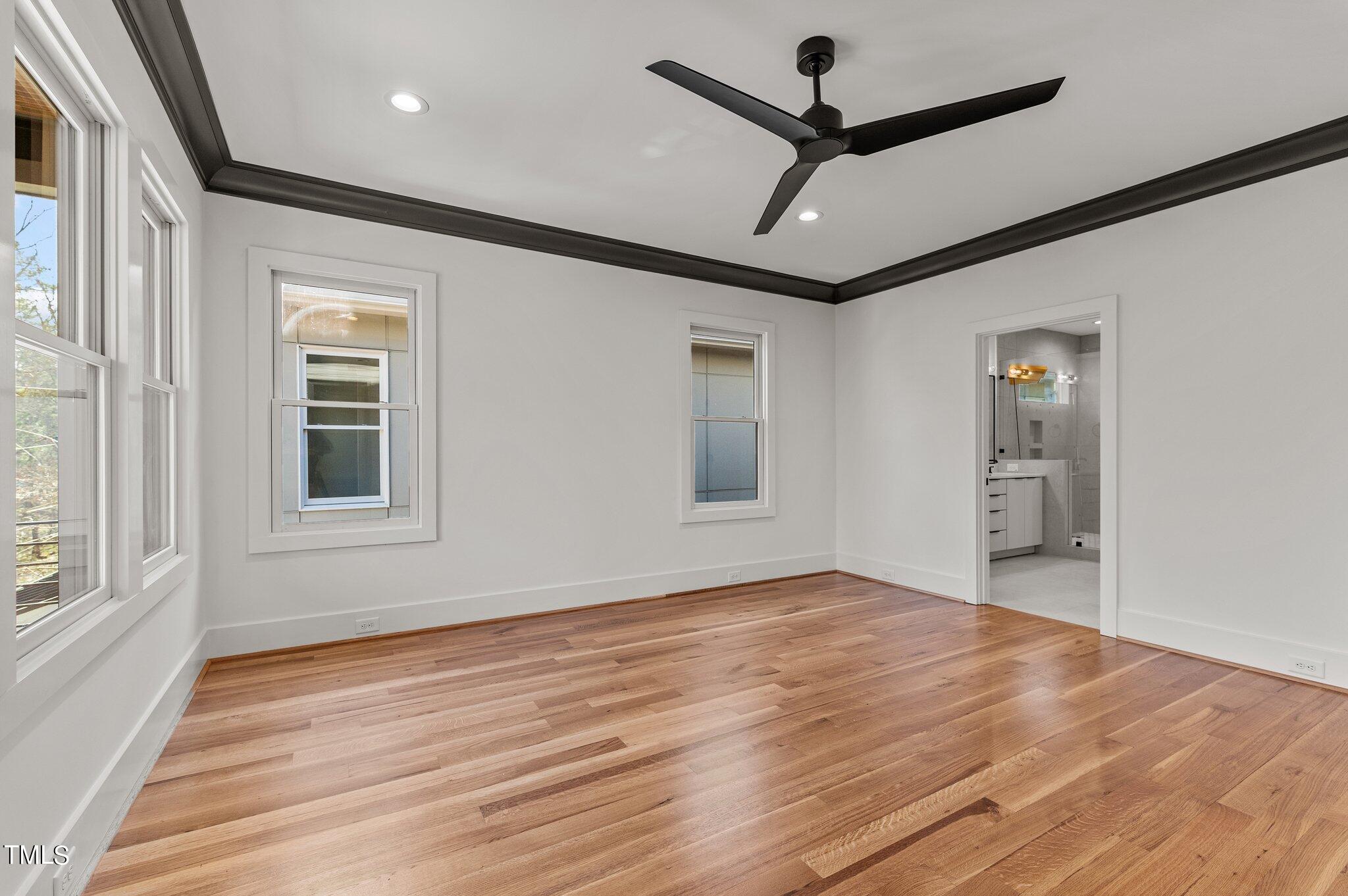 1437 Nottingham Road Raleigh, NC 27607 - Photo 36 of 61 a view of an empty room with a window and wooden floor