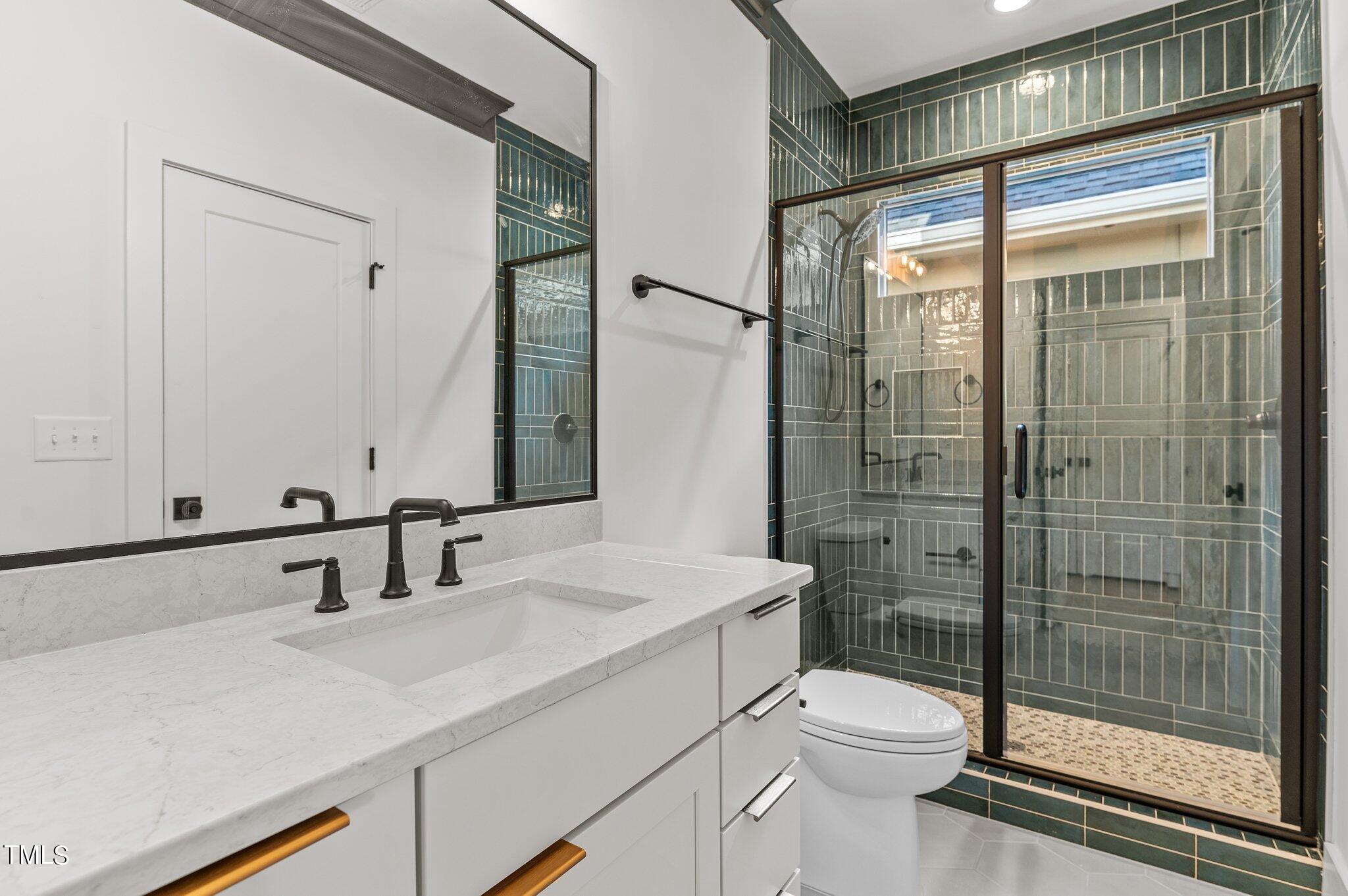 1437 Nottingham Road Raleigh, NC 27607 - Photo 42 of 61 a bathroom with a sink toilet and shower