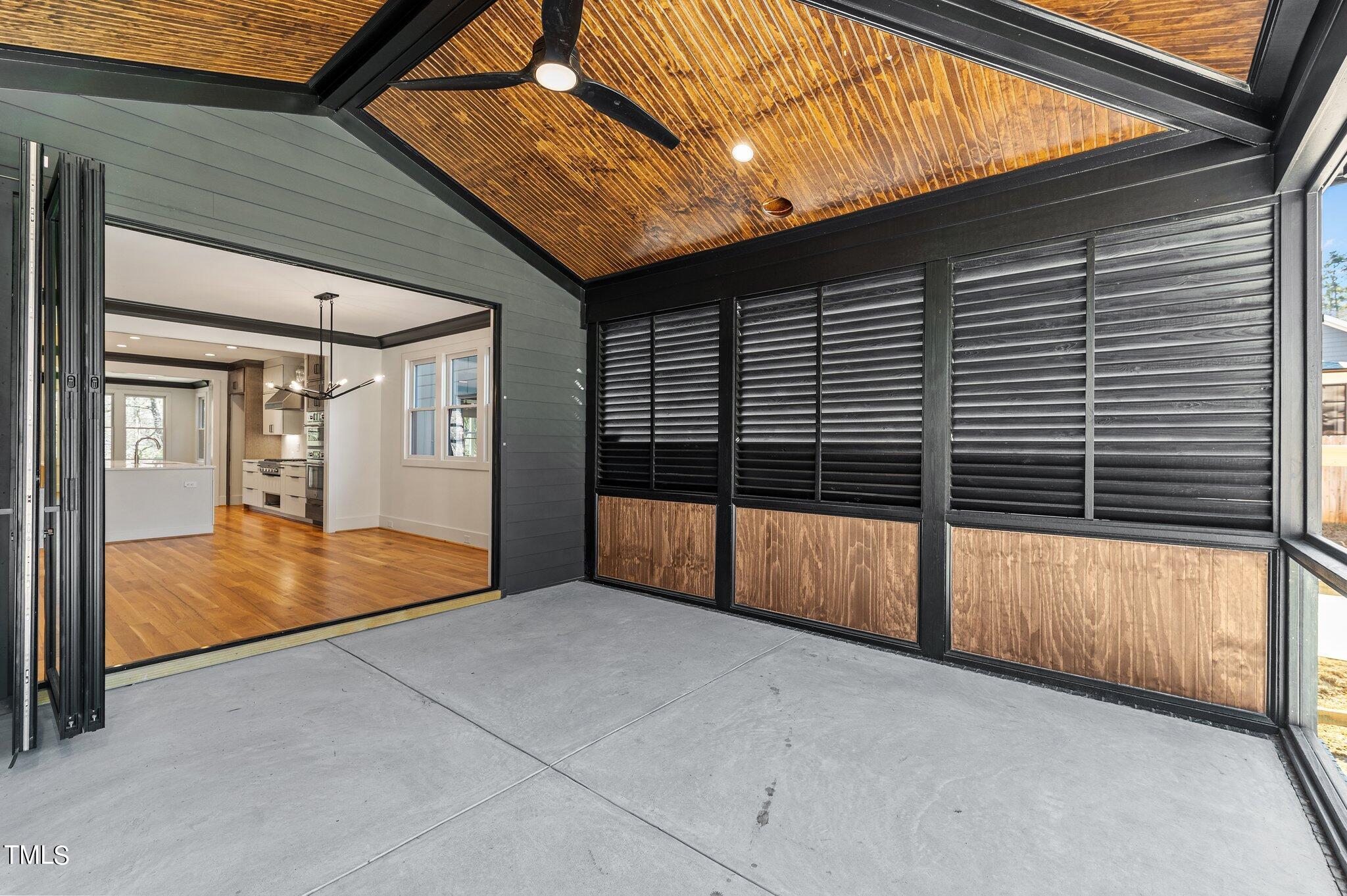 1437 Nottingham Road Raleigh, NC 27607 - Photo 51 of 61 a view of an empty room with a sliding door