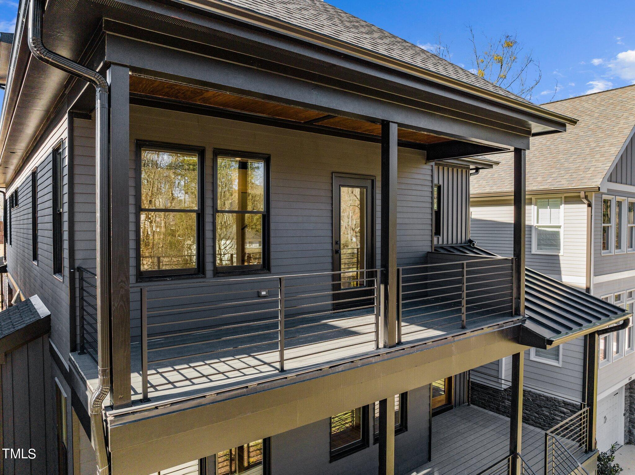 1437 Nottingham Road Raleigh, NC 27607 - Photo 59 of 61 a view of a house with a door and wooden floor