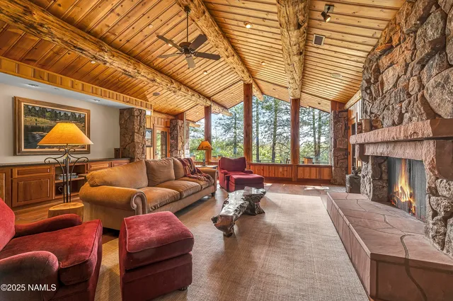 a room with a couch and a painting on the wall