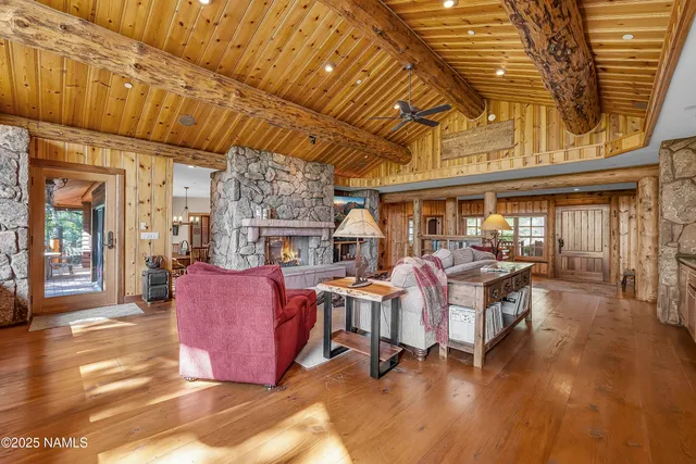 a view of a patio with table and chairs and wooden floor