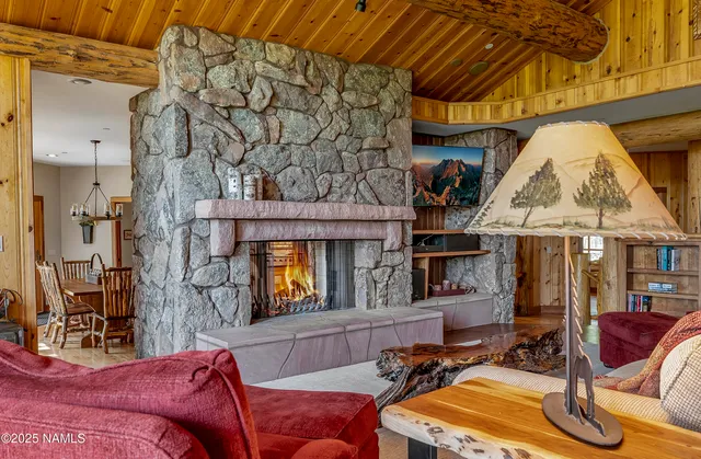 a view of a patio with table and chairs and wooden floor