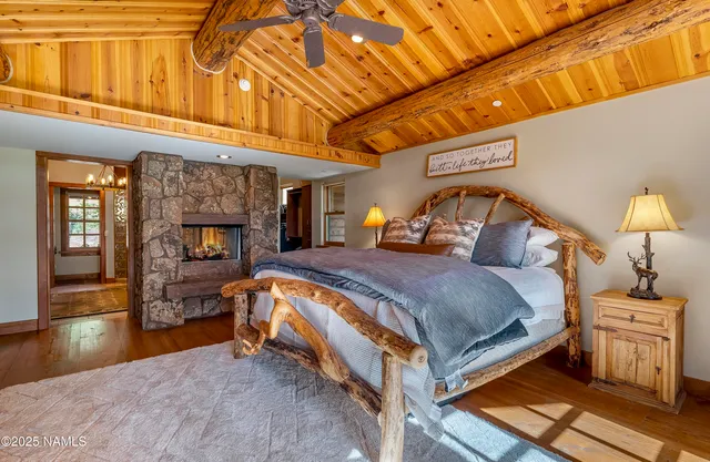 a view of a patio with table and chairs potted plants with wooden floor and fence