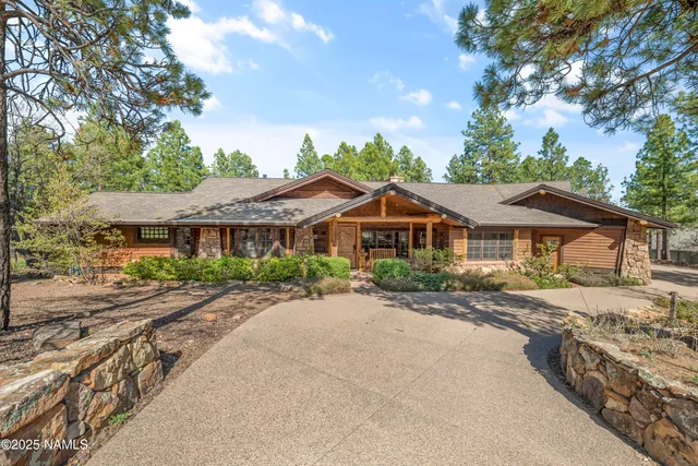 a view of a livingroom with furniture and a fireplace
