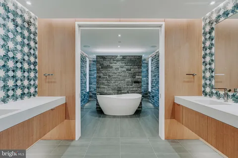 a bathroom with a bathtub and sink
