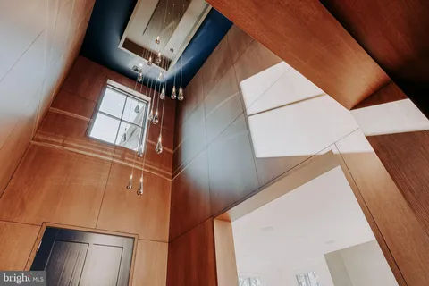 a view of an entryway with a kitchen