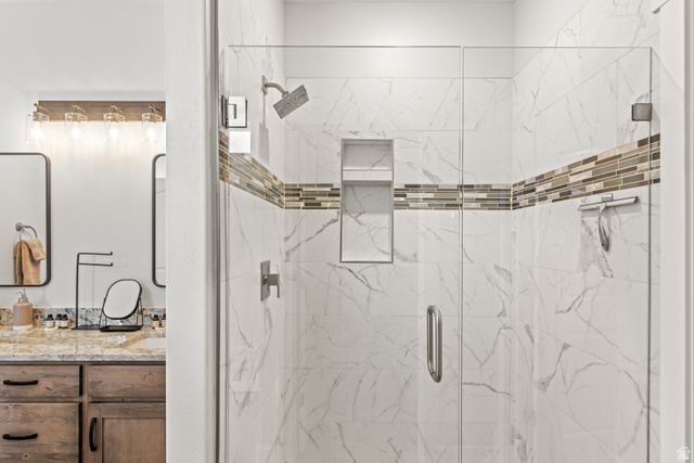 1343 North Trapper Loop Garden City, UT 84028 - Photo 20 of 56 Full bath featuring vanity and a marble finish shower