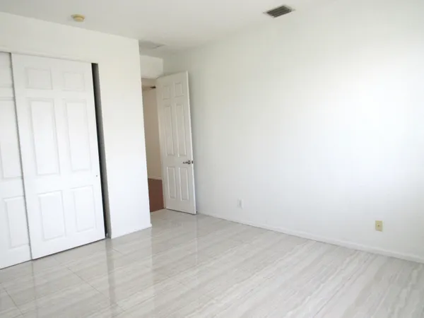 an empty room with wooden door