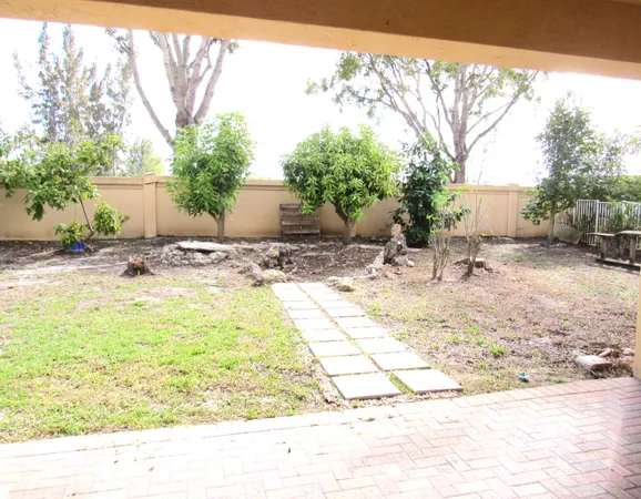 a view of a backyard of the house
