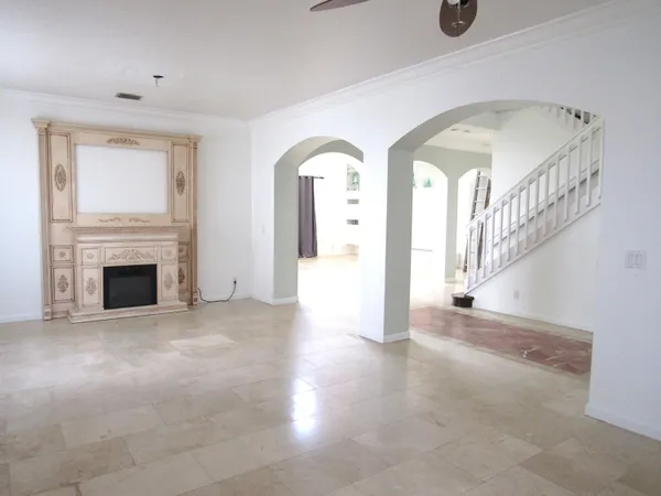 a view of empty room with fireplace