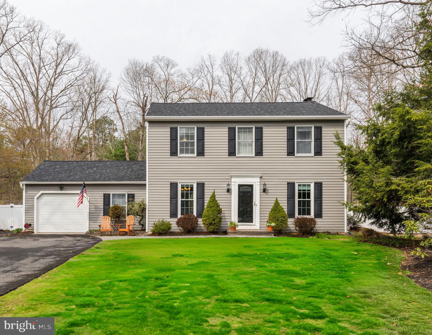 25 Wallingford Way Shamong, NJ 08088 - Photo 1 of 65 a front view of a house with a yard and trees
