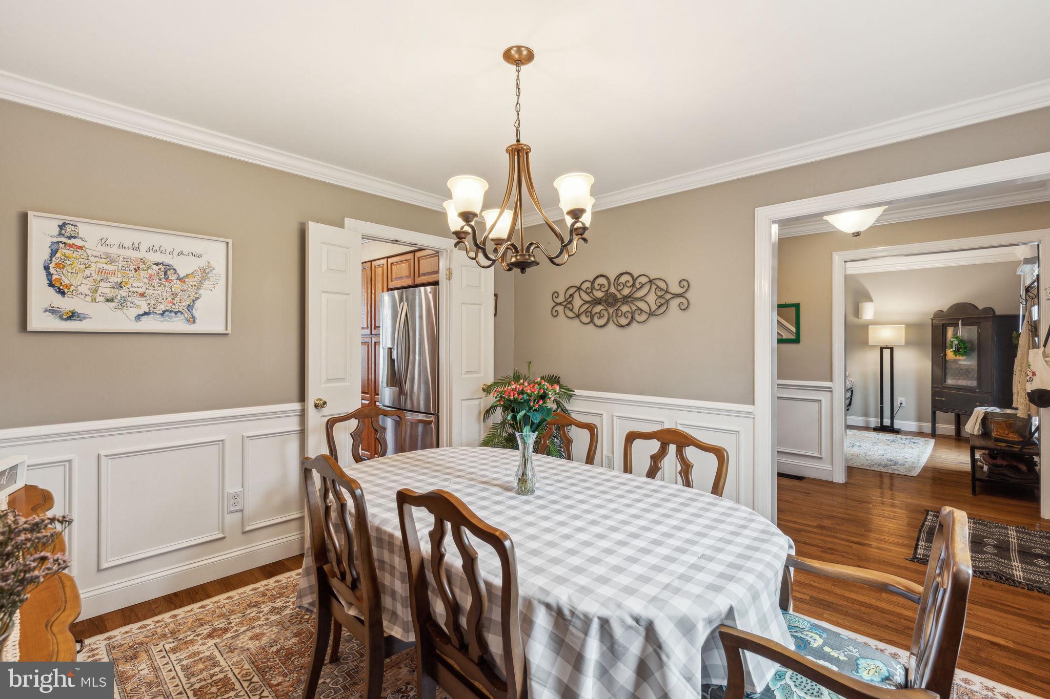 25 Wallingford Way Shamong, NJ 08088 - Photo 12 of 65 a view of a dining room with furniture and chandelier
