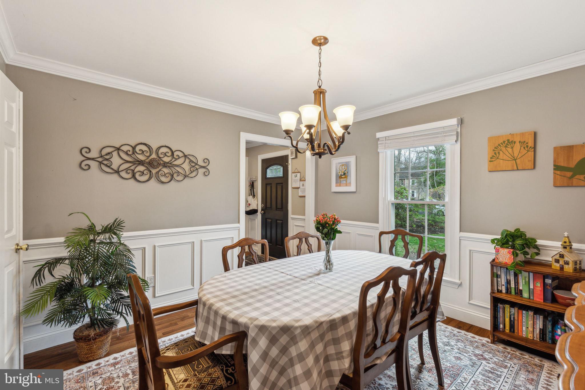 25 Wallingford Way Shamong, NJ 08088 - Photo 13 of 65 a view of a dining room with furniture a chandelier and wooden floor