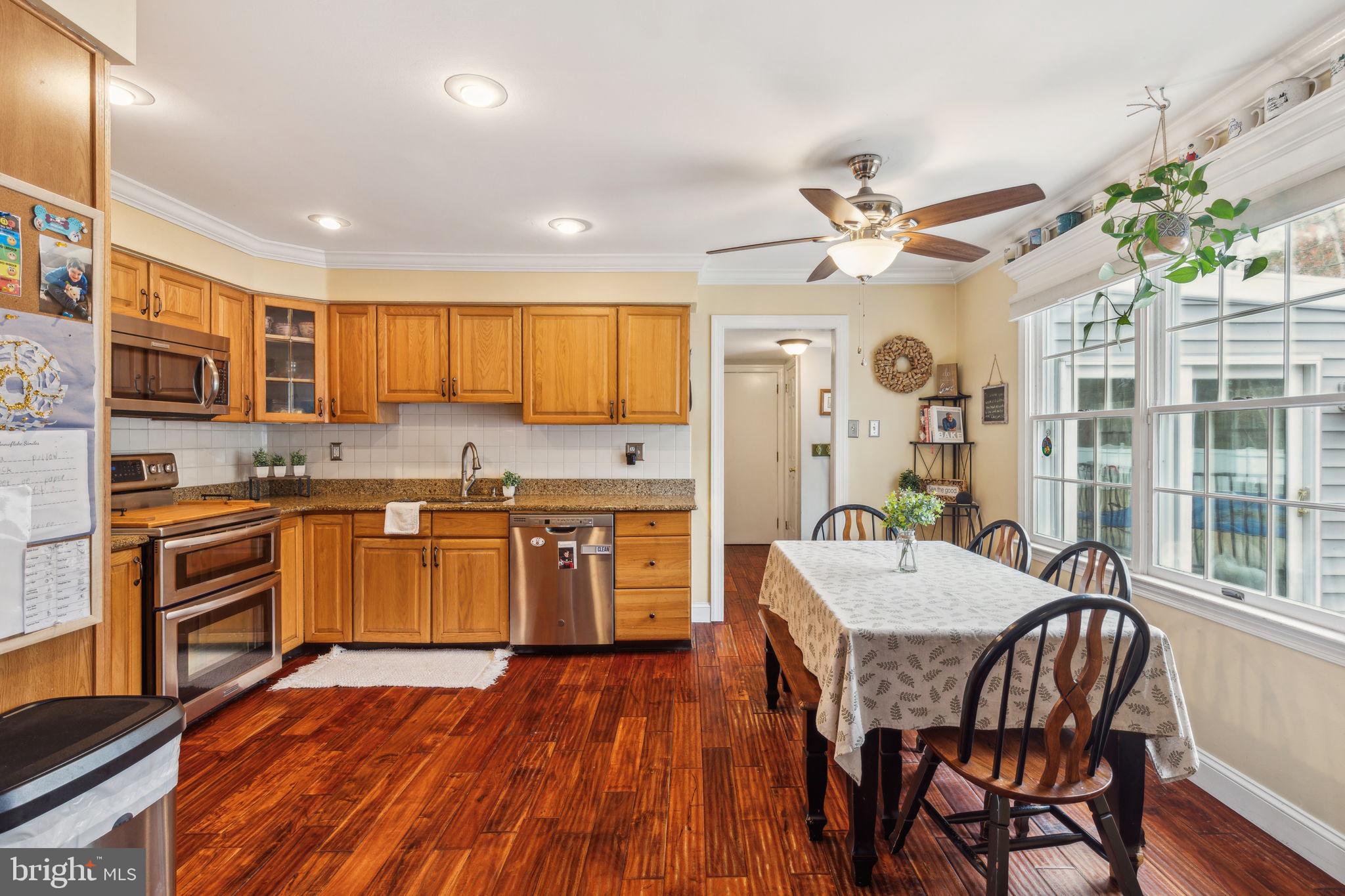 25 Wallingford Way Shamong, NJ 08088 - Photo 14 of 65 a kitchen with a table chairs microwave and cabinets