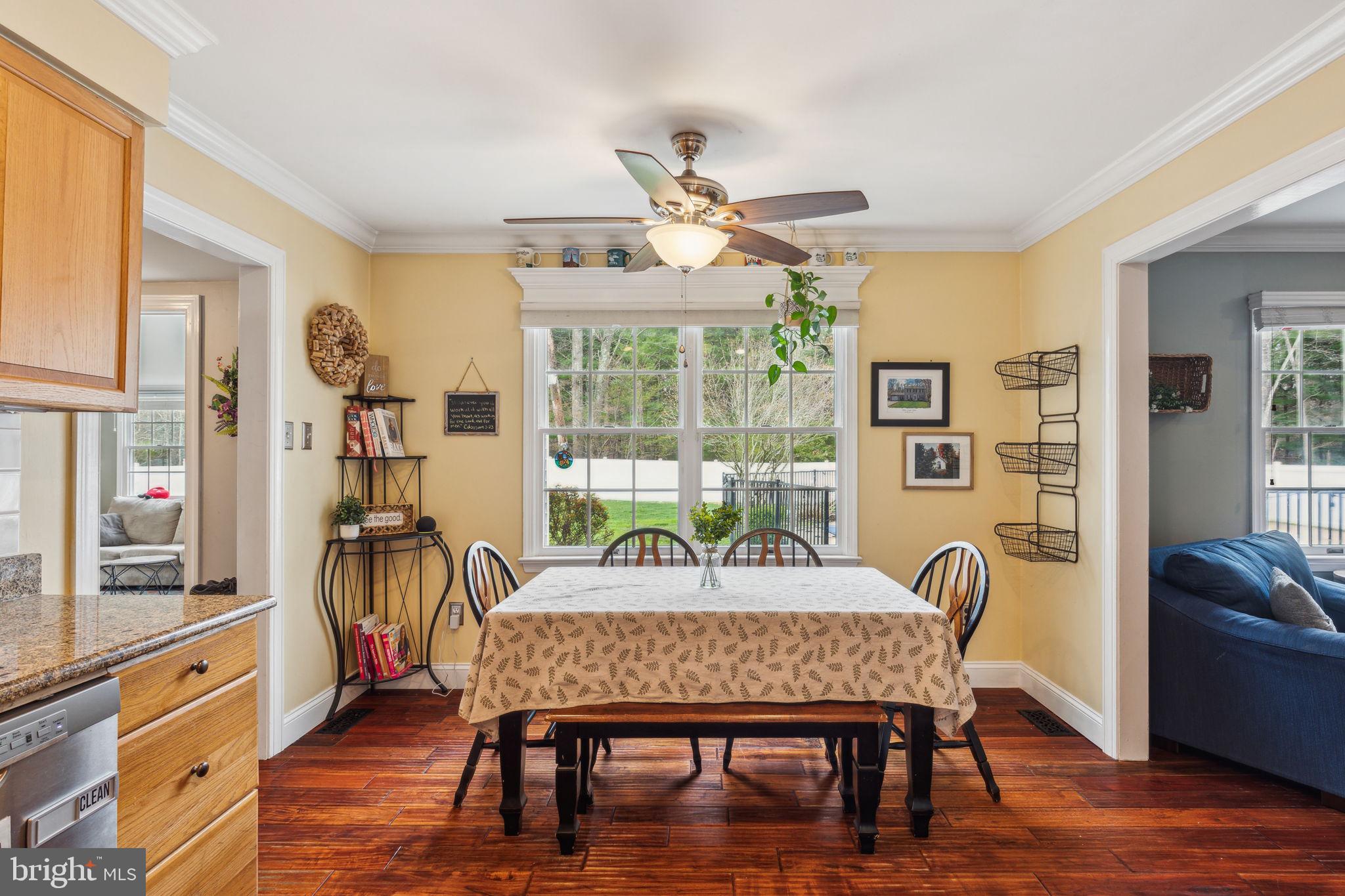 25 Wallingford Way Shamong, NJ 08088 - Photo 16 of 65 a dining room with furniture a chandelier and wooden floor