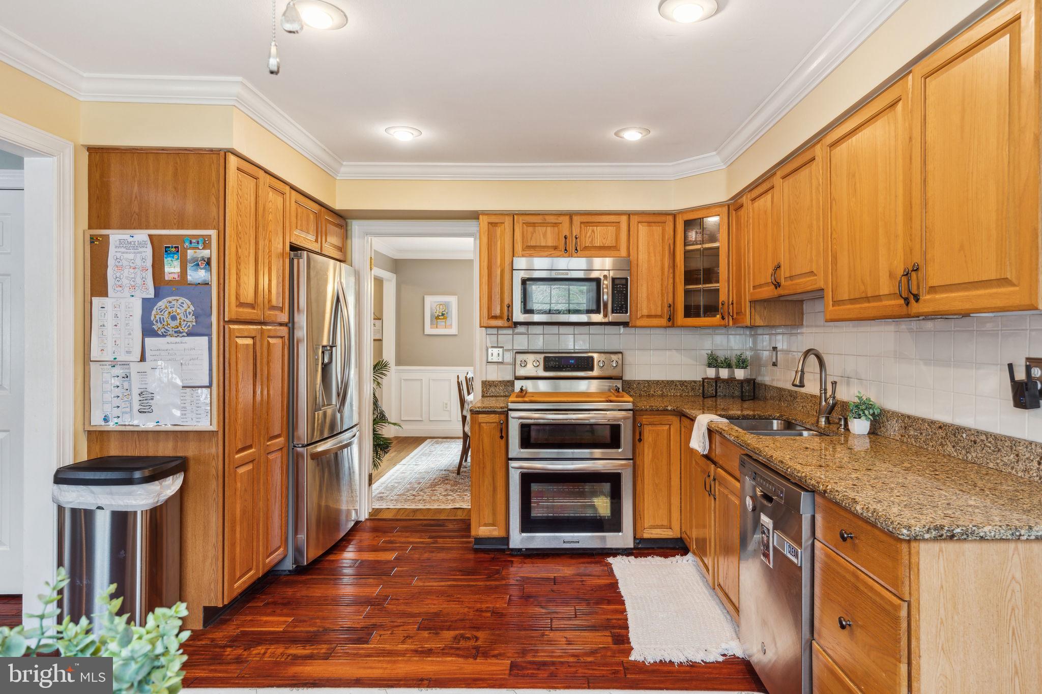 25 Wallingford Way Shamong, NJ 08088 - Photo 18 of 65 a kitchen with stainless steel appliances granite countertop a refrigerator a stove and a sink