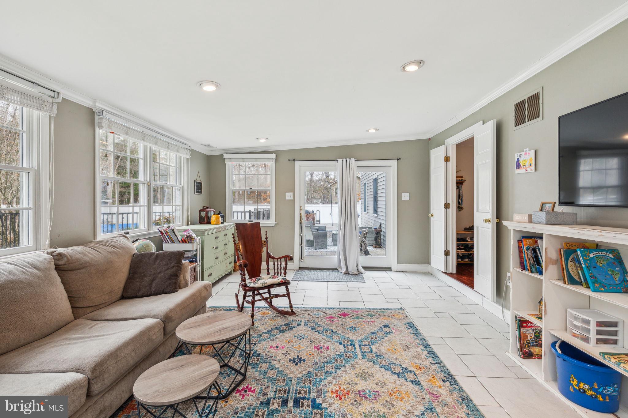 25 Wallingford Way Shamong, NJ 08088 - Photo 27 of 65 a living room with furniture and a flat screen tv
