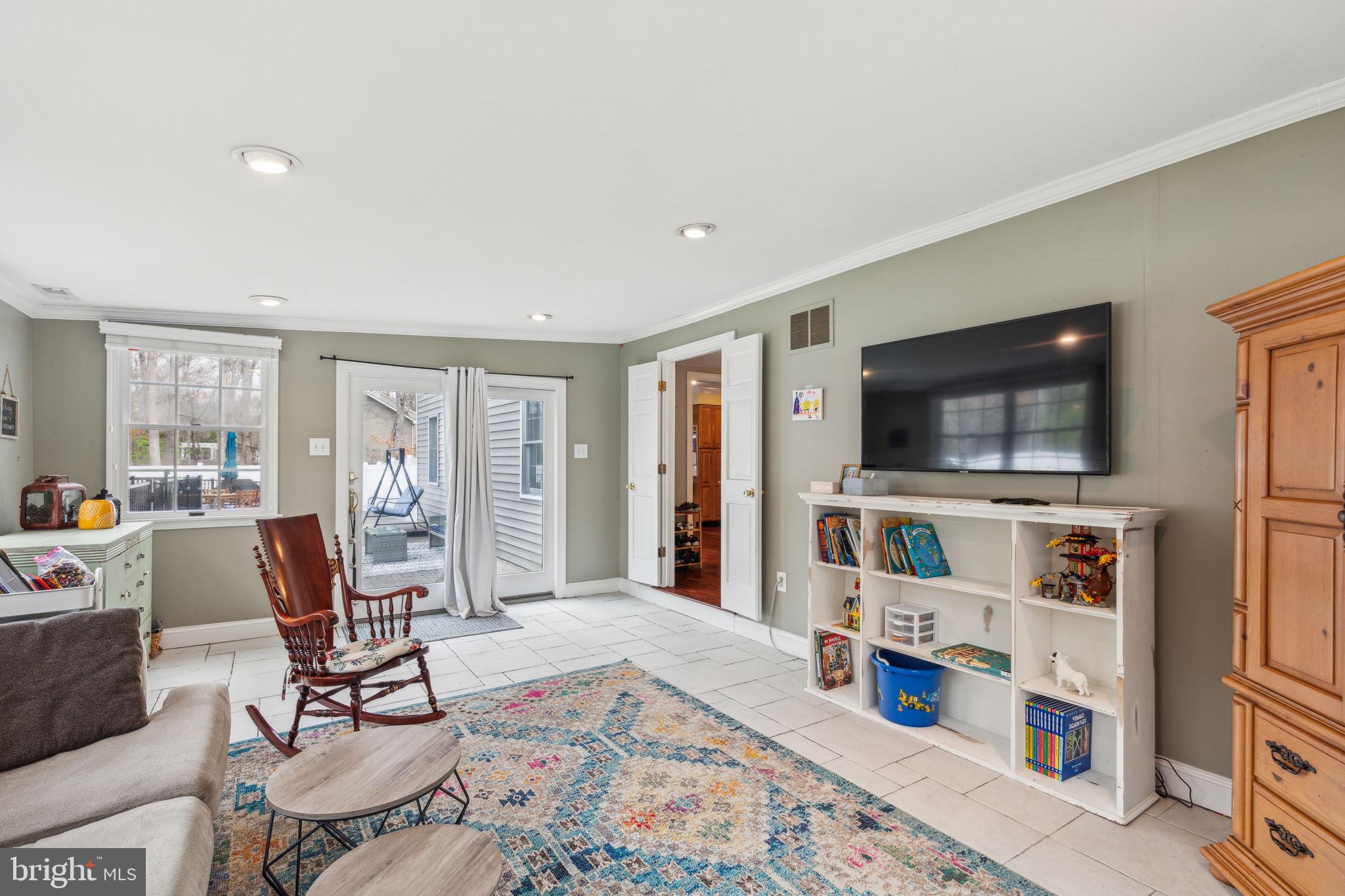 25 Wallingford Way Shamong, NJ 08088 - Photo 28 of 65 a living room with furniture and a flat screen tv