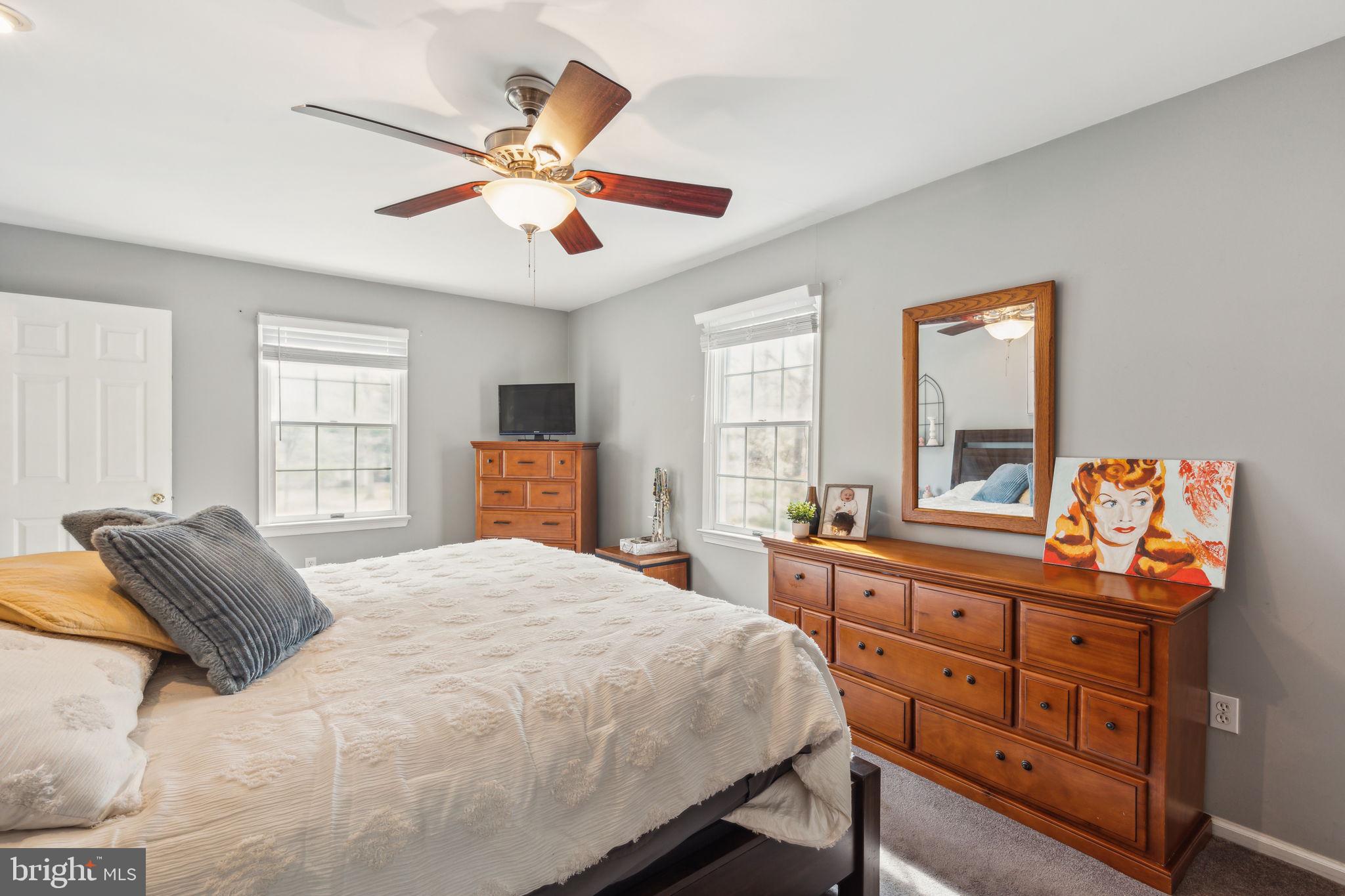 25 Wallingford Way Shamong, NJ 08088 - Photo 34 of 65 a bedroom with a bed and a dresser in it