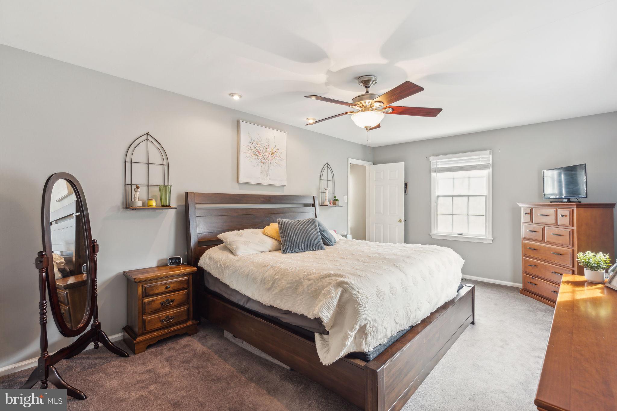 25 Wallingford Way Shamong, NJ 08088 - Photo 35 of 65 a bedroom with a bed a dresser and windows