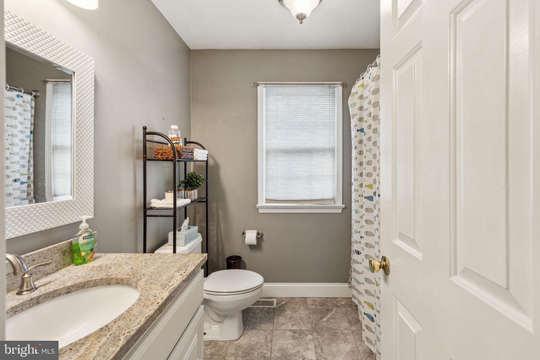 25 Wallingford Way Shamong, NJ 08088 - Photo 38 of 65 a bathroom with a granite countertop toilet sink and mirror