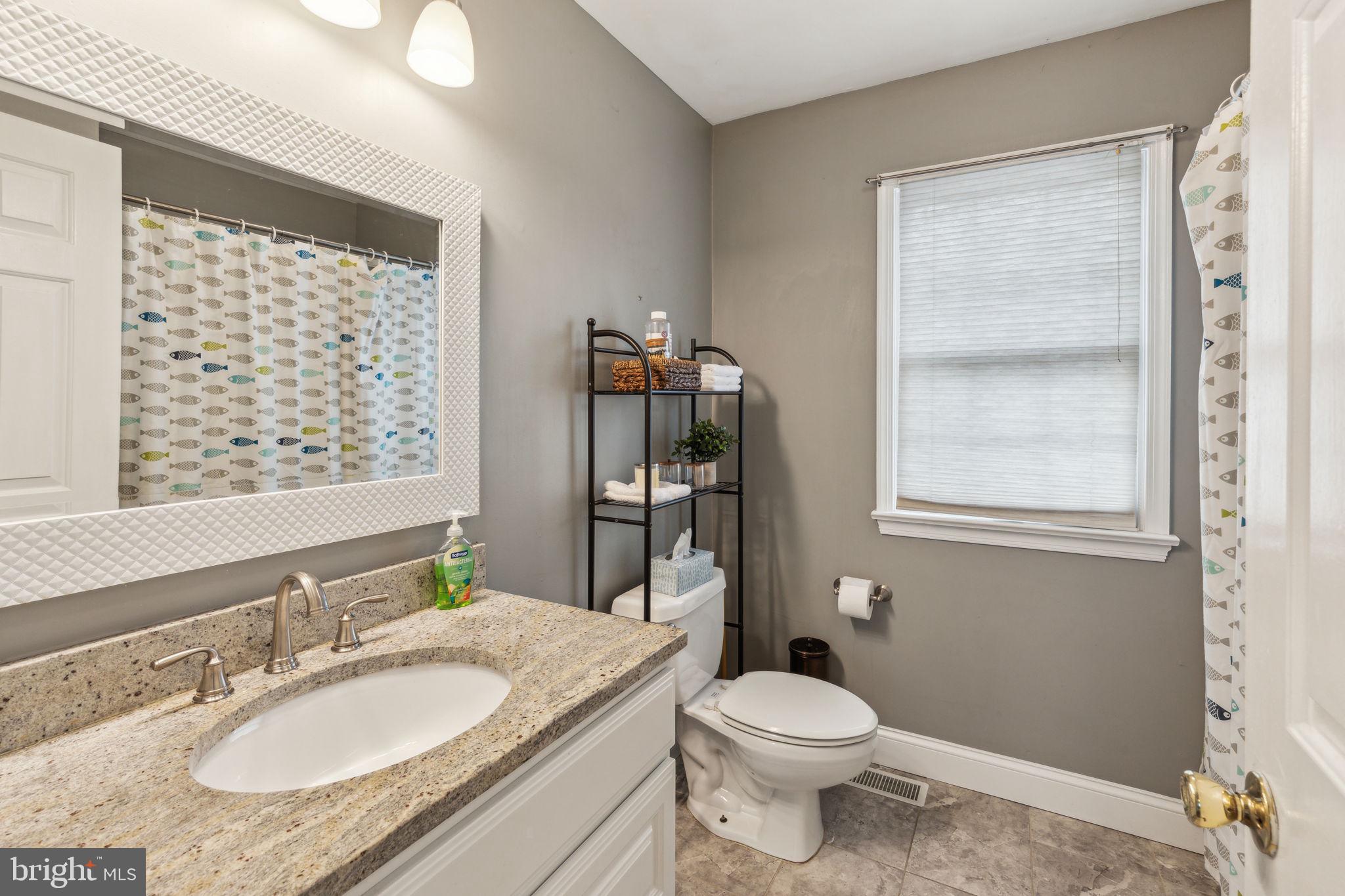 25 Wallingford Way Shamong, NJ 08088 - Photo 39 of 65 a bathroom with a granite countertop sink toilet and shower
