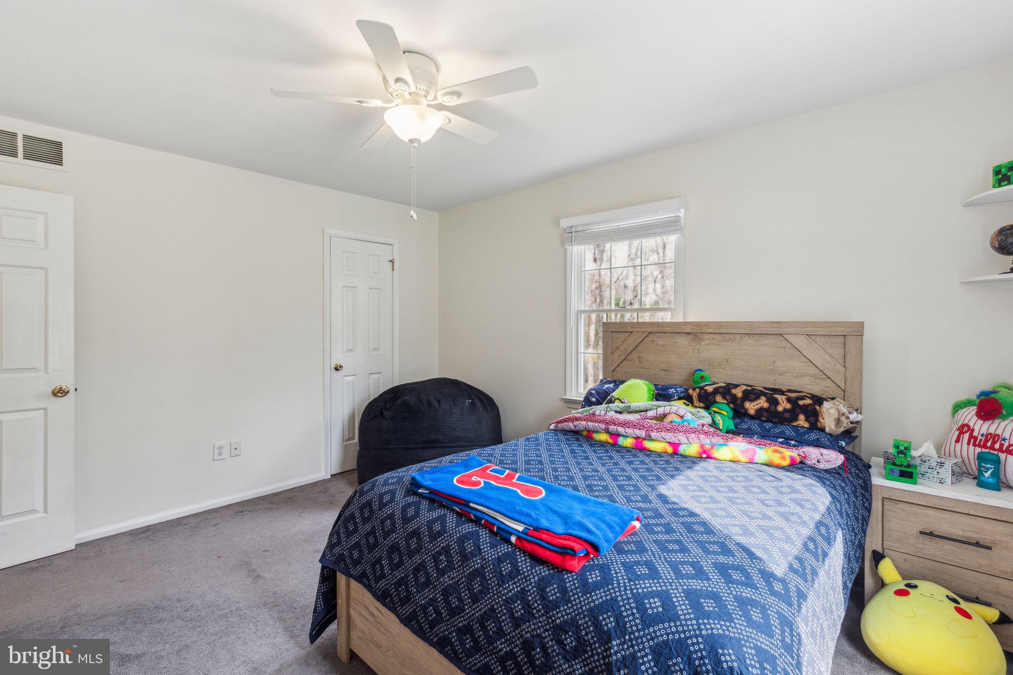 25 Wallingford Way Shamong, NJ 08088 - Photo 41 of 65 a bedroom with a bed and a lamp on the dresser