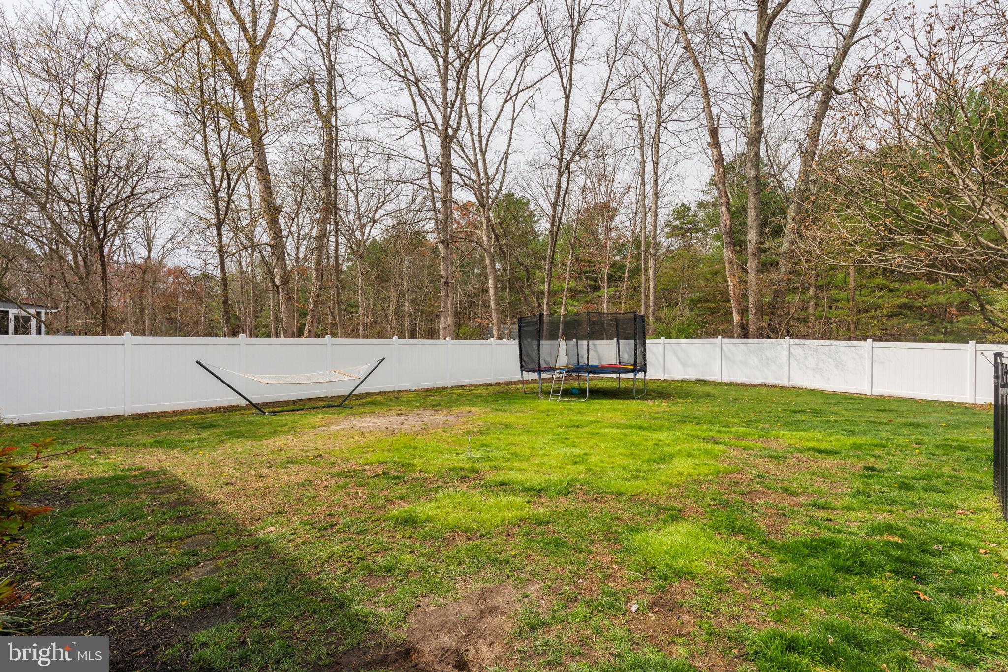 25 Wallingford Way Shamong, NJ 08088 - Photo 59 of 65 a view of yard with swimming pool and trees