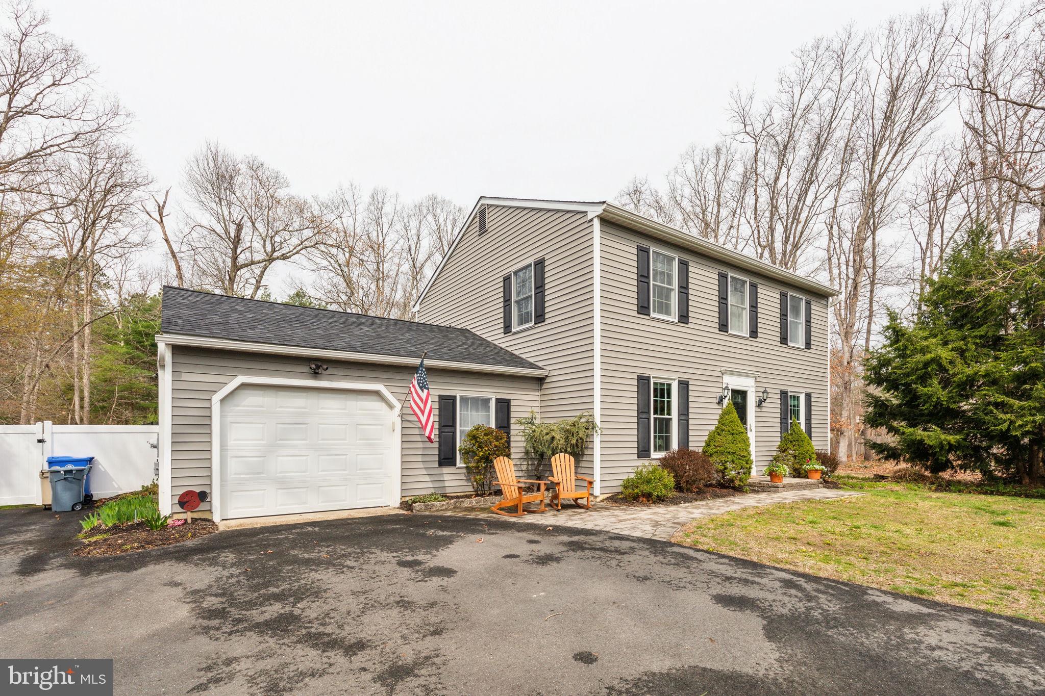 25 Wallingford Way Shamong, NJ 08088 - Photo 64 of 65 a front view of a house with a yard and garage