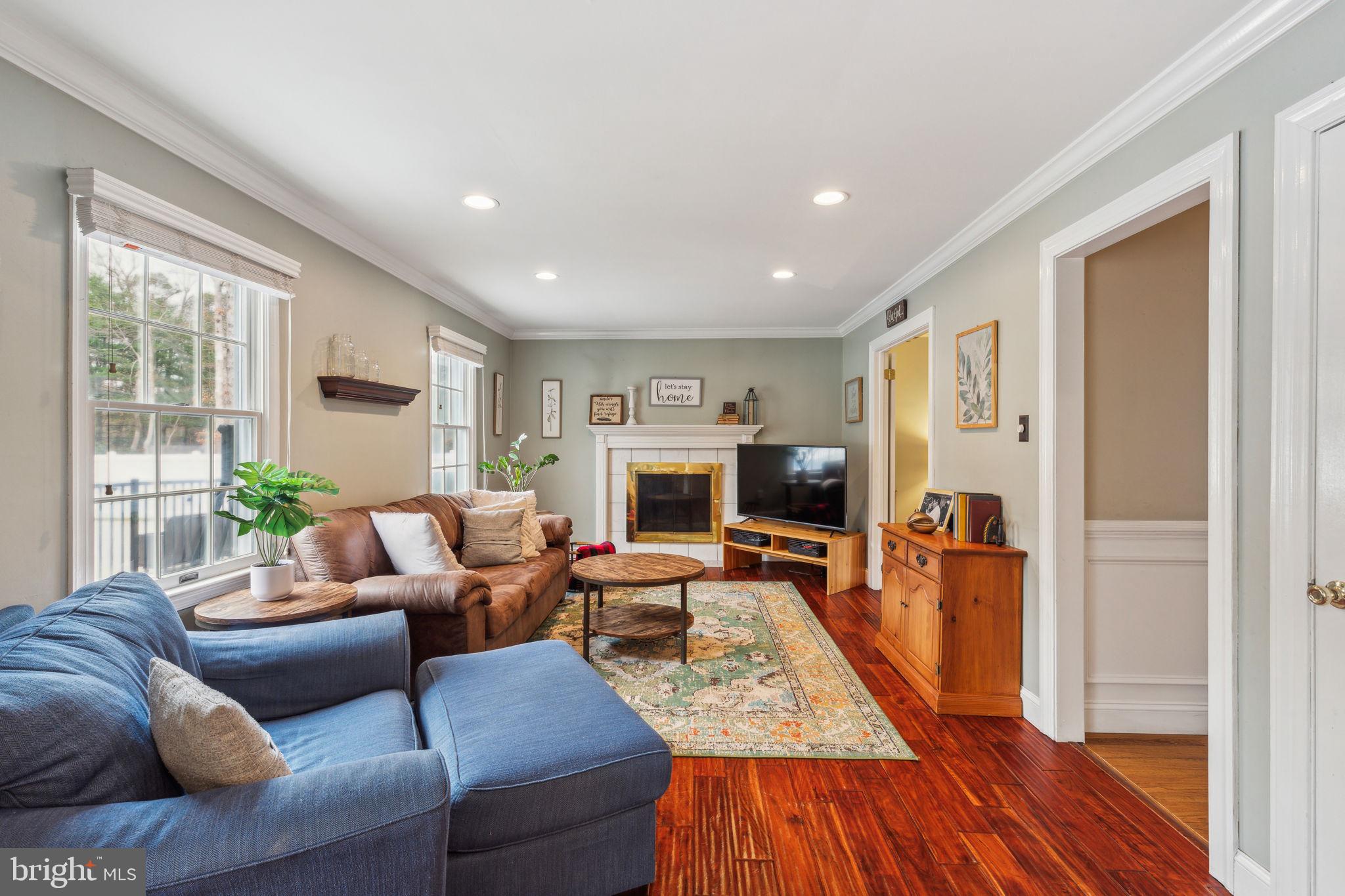25 Wallingford Way Shamong, NJ 08088 - Photo 8 of 65 a living room with furniture and a fireplace